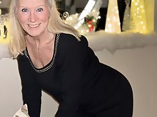 Hot MILF Tia posing in pink underwear for a photo session